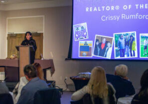 2024 REALTOR® of the Year Crissy Rumford speaking at Installation Celebration.